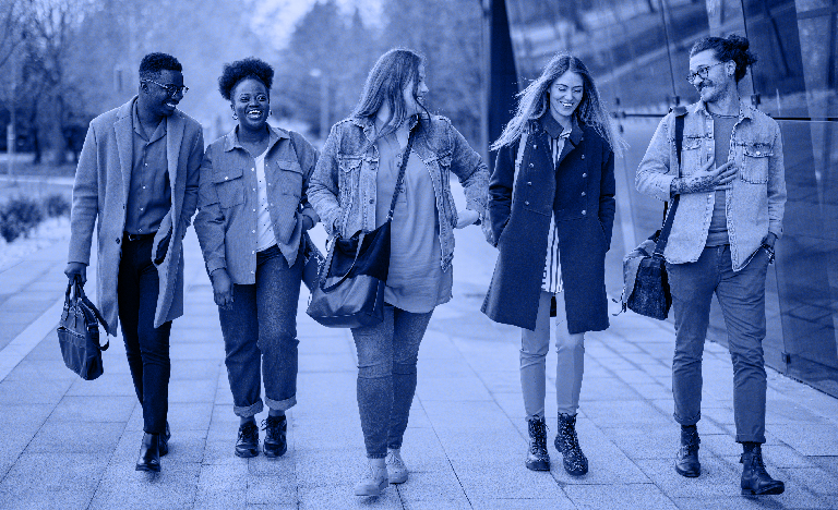 A group of college age students walking